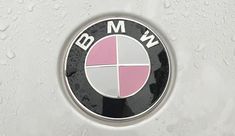 the bmw logo is shown on a white car