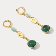 These exquisite Green Gemstone Earrings will add a touch of luxury and refinement to your look. Crafted from carefully selected gemstones, they feature a unique design that blends classic beauty and modern elegance. Perfect for special occasions or everyday glamour, these earrings are sure to be treasured. DETAILS Plating: 18K Gold Materials: 18K Gold on Brass, Cubic Zirconia, Gemstone Size: 1.77"*0.67"(45mm*17mm) Weight: 3.06g/pr Luxury Dangle Crystal Earrings, Elegant Natural Stone Hoop Earrings For Gift, Elegant Hoop Earrings With Natural Stones For Gift, Luxury Drop Earrings With Natural Stones, Elegant Gemstone Metal Earrings, Luxury Natural Stone Drop Earrings, Elegant Gemstone Dangle Hoop Earrings, Elegant Green Natural Stone Hoop Earrings, Elegant Gold Hoop Earrings With Natural Stones