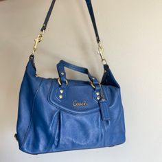 Coach Ashley Cobalt Blue Leather Satchel Style No F19247 Like New - Barely Used - Small Ink Stain On Inside Pocket (See Photos) A Beautiful Cobalt Blue Leather Purse Pleats On Front Gold Tone Hardware Gray Satin Lining Interior Has One Zip Pocket And Two Multifunctional Slip Pockets Coach Leather Hangtag Double Flat Straps With 5”- Drop One Single Flat Strap With 12.5” Drop Removable Zip Top Closure Ink Stain, Coach Leather, Leather Purse, Leather Satchel, Zip Top, Blue Leather, Cobalt Blue, Leather Purses, Coach Bags