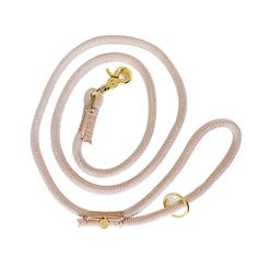 a pink leash with gold hardware on it