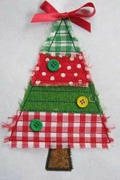 a christmas tree made out of fabric with buttons on the top and red gingham