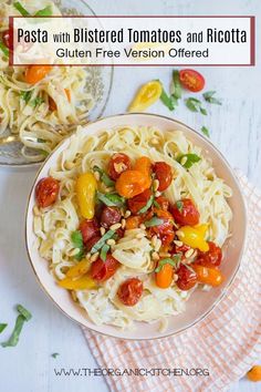 pasta with roasted tomatoes and ricotta in a white bowl on top of a pink towel