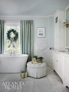 a white bath tub sitting next to a window