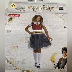 a cardboard cutout of a girl in harry potter costume with her hand on her hip