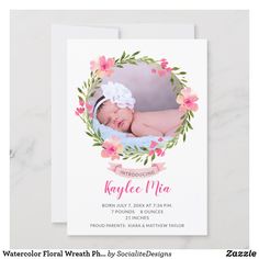 a birth announcement card with an image of a baby's head in a wreath