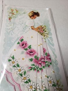 an image of a woman with flowers on her wedding dress in a package for paper crafts