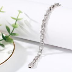 Express your creative side with the simple elegance of our chain bracelet. Crafted in sterling silver, the stylish piece gives your look a playful edge that lets you tell your story in your own unique way. Discover the complete selection of our classic chain bracelet for women.Carat Weight: 4.068 ctStone Size: 1.5,1.1,0.9 mmNumber of Stones: 344 Stone Shape: RoundStone Color: Diamond WhiteWeight: 13.52 gWidth: 8.5 mmHeight: 4.8 mmThickness: 7 mmMaterial: Stone Type: Jeulia® StonePlating Color: S Jewellery Chain, Chain Bracelet For Women, Tell Your Story, Bracelet Online, Chain Design, Simple Elegance, Bracelet For Women, Sterling Silver Bracelet, Tennis Bracelet