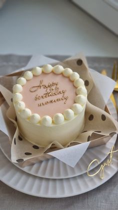 a birthday cake sitting on top of a paper plate