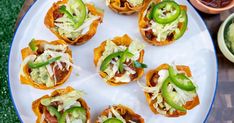 small appetizers are arranged on a white plate