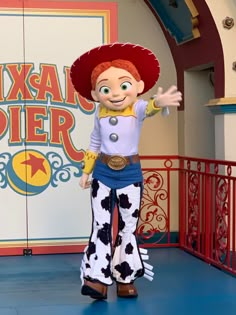 the toy story character poses for a photo