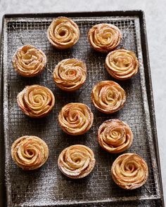 there are many small pastries on the baking sheet