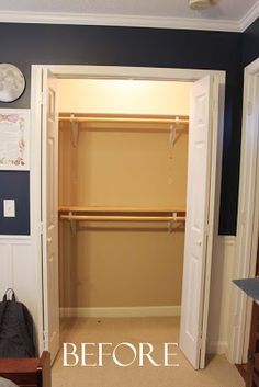 an empty bedroom with blue walls and white closet doors open to reveal a walk - in closet