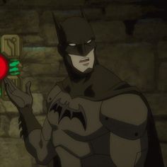 the animated batman character is holding up a stop sign