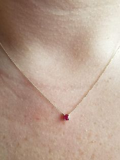 14K SOLID YELLOW GOLD 4 PRONG 0.25 CARAT RUBY SOLITAIRE NECKLACE Here is a dainty, delicate and simple, yet classy minimalist 4 Prong Ruby Solitaire Necklace. This is 14k Solid Gold. (We do not sell filled or plated jewelry) Perfect for everyday use. Metal : 14K Solid Gold Necklace Length : 16 inches / 41.5cm Pendant Width : 3.50mm Gemstone : 3.50mm Natural Ruby Total Carat: 0.25ct ---MADE IN USA--- ---Absolutely stunning. Comes in a gift box. ---Shipping Policy---- Item will be shipped within 4 Yellow Gold Ruby Necklace With Prong Setting, Minimalist Ruby Birthstone Necklace, Minimalist Gold Necklace With Prong Setting, Gold Ruby Necklace, Classy Minimalist, Dainty Cross Necklace, Tiny Heart Necklace, Solitaire Necklace, Solid Gold Necklace