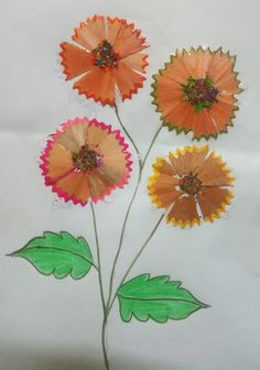 three paper flowers with green leaves on white paper and colored crayon pencils