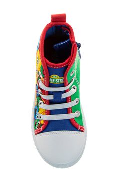 All of their favorite Sesame Street characters punctuate the upper of this high-top sneaker designed a lace-up vamp. Lace-up style; side zip closure Synthetic upper and lining/rubber sole Imported Sporty High-top Sneakers With Character Print, Multicolor High-top Sneakers For School, Fun High-top Sneakers For Sports, Fun High-top Sports Sneakers, School Lace-up High-top Sneakers With Rubber Sole, Cartoon Print Lace-up Sneakers For Streetwear, Non-slip High-top Sneakers For Playtime, Multicolor High-top Sneakers, Playful Lace-up Sneakers For Playtime