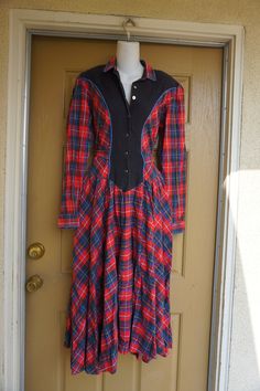 "90s plaid dress. Buttons in the front. Labeled size 11/12. Made by Temtex. Has small shoulder pads and pockets!! Condition - is worn with light pilling and fading. measurements taken across front laid flat 18.5\" across front armpit to armpit 15\" across front of waist 28\" hips 51\" length" Fitted Vintage Plaid Dress, Fitted Plaid Dress With Buttons, 90s Plaid Dress, Dress Buttons, Medium Dress, Plaid Dress, Vintage Wool, Label Sizes, Shoulder Pads