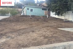 a yard that has been dug up with dirt