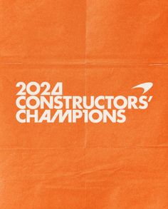 an orange paper bag with the words 2012 constructors'championships written in white on it