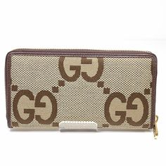 GUCCI Jumbo GG Zip Around 699316 Camel & Ebony/Brown Long WalletBrand: GucciGender: WomenModel: 699316Country of Origin: ItalyColor: Brown, CamelMaterial: GG canvasSize (HxWxD): 10cm x 17cm x 3.5cm / 3.93'' x 6.69'' x 1.37''