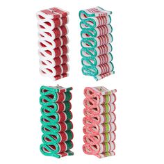 four different styles of hair clips in various colors and shapes, one with green, pink, and blue