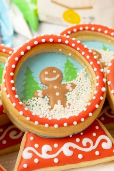 cookies decorated with icing and sprinkles are on display