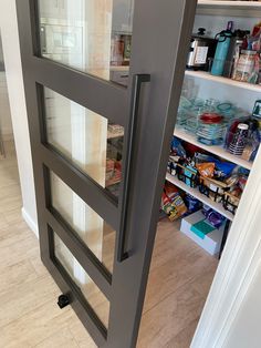 an open door to a pantry filled with food