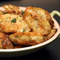 some fried food in a white bowl on a table