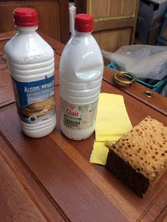 two bottles of water, crackers and cheese on a table