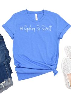 Look your sweetest in the official Sydney So Sweet tee! Made of a blissfully soft cotton blend, this high-quality short sleeve shirt comes in six delicious colors and seven sizes, so you're sure to find your perfect fit. Plus, show off your love of this sweet company! INCLUDES: T-Shirt UNISEX SIZES: XS, S, M, L, XL, XXL, XXXL FIT: This item is true to size. FABRIC & CARE: Machine Washable 100% combed and ring spun cotton (fiber content may vary for different colors) Bella + Canvas Brand This cla Sweet Summer T-shirt With Crew Neck, Sweet Short Sleeve Cotton T-shirt, Sweet Style Short Sleeve Cotton T-shirt, Sweet Cotton T-shirt With Short Sleeves, Sweet Summer T-shirt With Letter Print, Summer Sweet T-shirt With Letter Print, Cute Soft-washed Short Sleeve T-shirt, Sweet Tee, Columbia Blue