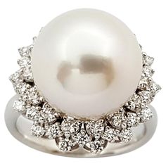 South Sea Pearl with Diamond 0.38 carat Ring set in 18 Karat White Gold Settings Width: 1.8 cm Length: 1.8 cm Ring Size: 51 Total Weight: 8.92 grams South Sea Pearl: 12.6 mm "We first opened doors in 1980 when it was then situated in the vicinity of the Victory Monument; a small and modest storefront with a couple of counters. From its humble beginnings to where it stands today, our company has proven its abilities as a jeweler. Since the beginning, we have been supplying fine quality pieces to Luxury Pear-shaped White Gold Diamond Ring, Luxury 14k White Gold Diamond Ring With 17 Jewels, Luxury White Gold Pear-shaped Cluster Ring, Luxury Pear-shaped White Gold Cluster Ring, Luxury Pear-shaped Rings With Pave Setting, Luxury Platinum Cluster Jewelry, Luxury White Gold Cluster Diamond Ring, Luxury Platinum Jewelry With Cluster Design, Luxury Brilliant Cut Diamond Pearl Ring