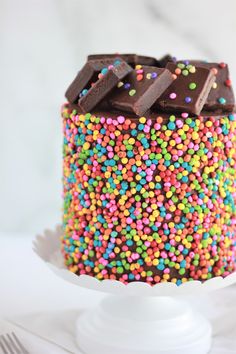 a cake with chocolate and sprinkles on it