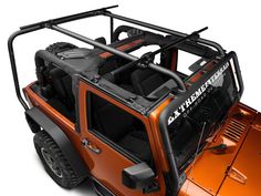 an orange jeep is shown with the top down and its cargo compartment opened to show off