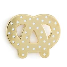 a gold brooch with the letter a in it's center and an interlocked design