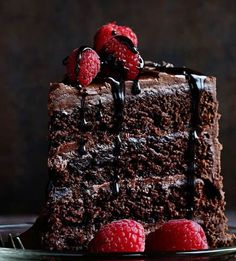 a chocolate cake with raspberries on top and the words no fail chocolate cake this is