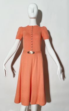 Coral knit dress. Removable belt. Front buttons. Stretchy. *Condition: excellent vintage condition. No visible flaws. Measurements Taken Laying Flat (inches)-- Shoulder to Shoulder: 12 in. Bust: 28 in. (unstretched)  Waist:  25 in. Hip: 34 in. Length: 41 in. Marked size: N/A, best fit for XS. Classic Fitted Belted Dress For Daywear, Fitted Midi Length Belted Dress With Buttons, Formal Fitted Belted Dress With Buttons, Knee-length Fitted Belted Dress With Buttons, Fitted Knee-length Belted Dress With Buttons, Belted Dress, Dress Clothes For Women, St John, Knit Dress