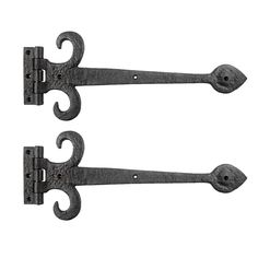 pair of wrought iron door handles on white background