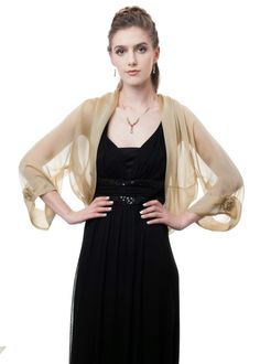 This gorgeous sheer bolero, with a loose-fitting silhouette is made of finest 100%l silk iridescent chiffon in soft pale gold color. It has luxurious details such as wide soft folds attached to the bolero's edges. The long sheer sleeves are adorned with lovely silk rosettes and vintage rose Swarovski crystal, which gives this formal jacket a truly glamorous effect. This jacket has a loose silhouette and one size fits two. XS-S: 32-34 x 25-27 x 34-36 Bust Waist Hips M-L: 36-38 x 28-30 x 38-40 Bus Formal Bolero, Women Shrug, Kebaya Lace, Gold Shawl, First Ladies, Shrugs And Boleros, Plus Size Party Dresses, Bolero Jacket, Gray Silk