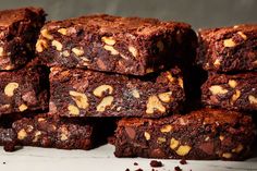 a pile of brownies sitting on top of a table