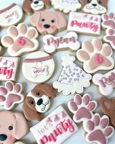 dog themed cookies are arranged on a table