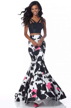 Portray the rich variety in design of this dress by Sherri Hill 51824. This two piece taffeta dress appeals in a sleeveless, V-neckline crop top styled with cutouts, bow accents on shoulder and a V-back. The floral print skirt forms an eye-catching mermaid silhouette and finishes in a sweep train. This Sherri Hill dress is perfect for a standout style and flawless fit. Style: sher_51824 Details: Two piece, Taffeta, Floral print, Mermaid skirt, Cutouts, Bow accents on shoulders, V-back, Sweep tra Gender Euphoria, Long Mermaid Dress, Floral Print Gowns, Sherri Hill Prom, Sherri Hill Prom Dresses, Dream Prom, Prom Dresses Two Piece, Taffeta Dress, Fashion Skirts