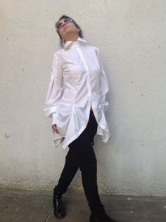 "This is a lovely slim fit white blouse.Buttons fastering.The fabric is cotton. Suitable for every occasion.Looks great with leggings,long pants and jeans. SIZE CHART SIZE S - US 6, UK 8, EU 36 bust: bust around 34.5\"/90cm Waist: waist around 27.5\"/70cm Hips: hips around 34.5\"/90cm SIZE M - US 8, UK 10, EU 38 bust: bust around 37.5\"/95cm Waist: waist around 29.5\"/75cm Hips: hips around 37.5\"/95cm SIZE L - US 10, UK 12, EU 40 bust: bust around 39.5\"/100cm Waist: waist around 31.5\"/80cm Hi Stretch Cotton Office Blouse, White Slim Fit Spring Blouse, Chic Fitted Cotton Shirt, Stretch Cotton Blouse For Office, White Slim Fit Cotton Blouse, Chic Slim Fit Cotton Blouse, Chic Cotton Slim Fit Blouse, Stretch Cotton Blouse With Buttons, Fitted Shirt For Office Wear In Spring