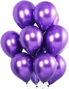 a bunch of purple balloons are in the air