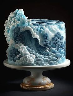 a blue and white cake with waves on it