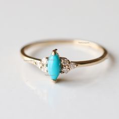 Pretty Marquise turquoise Trio diamond Engagement ring, Arizona Turquoise Ring, Gemstone Petite Ring. The stones can also be of other shape or kind. Product info: Main gemstone: turquoise Shape: Marquise cabochon Measurements: approx. 6*3mm Side stones: white diamonds Shape: round Measurements: approx. 1.5 mm Quality: I-J color, SI clarity, conflict-free Ring Size : US 7 Item will be resized and shipped within 10 days. ITEM Will BE SHIPPED : India Speed Post To get the item in 4-5 days, we can a Turquoise Promise Ring With Center Stone, Turquoise Accent Stones Promise Ring, Turquoise Accent Stones Jewelry For Promise Ring, Turquoise Diamond Rings With Center Stone, Turquoise Diamond Rings With Gemstones, Turquoise Multi-stone Promise Ring Jewelry, Turquoise Gemstone Jewelry For Promise Ring, Turquoise Jewelry With Gemstone Accents For Promise Ring, Turquoise Diamond Rings Fine Jewelry