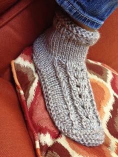 a person's foot wearing a knitted boot sock