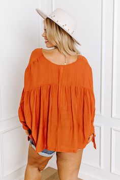 You and this darling plus size rust colored shift top were made for each other with its lightweight material, a button up front with a rounded neckline, long loose sleeves with tie closure cuffs, and a relaxed silhouette that falls into a straight hemline! Measurements 1XL : Bust 62", Hip 56", Length 25", Sleeve Length 23", Waist 60". 2XL : Bust 64", Hip 58", Length 25.5", Sleeve Length 23", Waist 62". 3XL : Bust 66", Hip 60", Length 26", Sleeve Length 24", Waist 64". Rust Color, Model Fits, Women Clothing Boutique, Hip Length, Online Womens Clothing, Boutique Clothing, Length Sleeve, Button Up, Sleeve Length