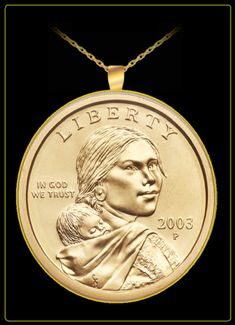 a gold medal with a woman holding a child