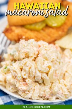 hawaiian macaroni salad on a plate with pickles and bread in the background