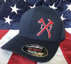 a baseball cap with an american flag in the background